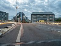 empty city street with traffic lights at night and building in the background in urban area