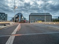 empty city street with traffic lights at night and building in the background in urban area