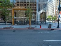 an empty street with buildings and parked cars on the sidewalks and green lanes on the sidewalk