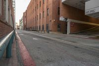 a bus drives by a parking garage on a street and buildings are next to it