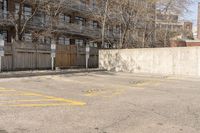 an empty parking lot with multiple markings for parking spots on it and no people walking