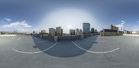 a city view of the street with empty parking lot in front of it and a sky scraper with a large circle drawn on the ground