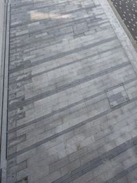 a white bench and some windows and a wall with tiled floors and tile on it