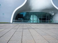 an entrance to an architectural building with circular windows that have an arch in it,