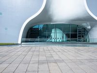 an entrance to an architectural building with circular windows that have an arch in it,