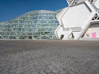 the exterior of a building, with a big structure on it's side, at the same time