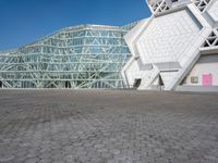 the exterior of a building, with a big structure on it's side, at the same time