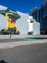 there is a yellow bear on the outside wall of the building that houses the olympic museum