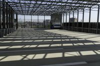 metal structure with sunlight in a building area on sunny day, including floor tileing