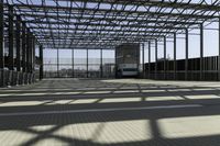 metal structure with sunlight in a building area on sunny day, including floor tileing