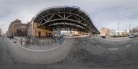 a fish eye shot of a wide angle view of a street corner in an urban area