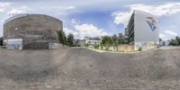 the reflection is seen in a 360 - view fish eye view of an urban area