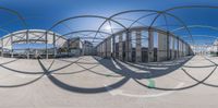 a fish eye view of a large hangar with circular designs in the air and on the ground