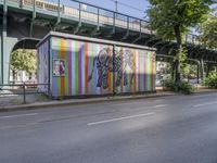 the city has two street murals on it, both one with a lady in a bikini