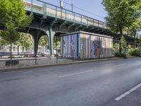 the city has two street murals on it, both one with a lady in a bikini