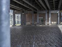 an empty parking garage with some large windows in the building below the roof of the building