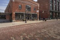 brick cobble streets are a popular place for visitors to enjoy their time outdoors at the waterfront in baltimore, maryland