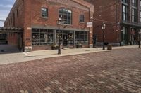 brick cobble streets are a popular place for visitors to enjoy their time outdoors at the waterfront in baltimore, maryland