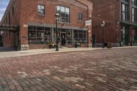 brick cobble streets are a popular place for visitors to enjoy their time outdoors at the waterfront in baltimore, maryland