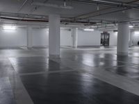 an empty parking garage with no people, no cars or windows in it, and yellow fixtures