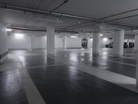 an empty parking garage with no people, no cars or windows in it, and yellow fixtures