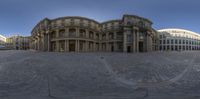 some very pretty buildings in a big courtyard in a town place in europe to use as a webcam