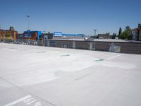 a view of an empty parking lot, with one in the center of the image