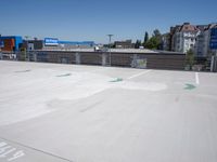 a view of an empty parking lot, with one in the center of the image