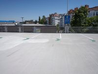a view of an empty parking lot, with one in the center of the image