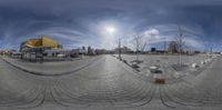 360 - view photograph of street with plaza and buildings in the back ground of the image