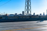 a view of a large bridge with lots of traffic on it and a bright blue sky