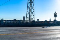 a view of a large bridge with lots of traffic on it and a bright blue sky