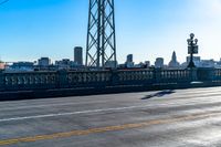 a view of a large bridge with lots of traffic on it and a bright blue sky