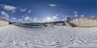 a large ski slope in an empty area, with lots of snow on the ground