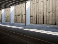 a city subway has stopped on a narrow sidewalk in the city on the first line