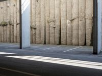 a city subway has stopped on a narrow sidewalk in the city on the first line