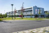 an empty street and an office building in the distance on a clear day in europe