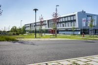 an empty street and an office building in the distance on a clear day in europe