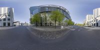 a fish eye view of the streets in an urban city area with buildings and people