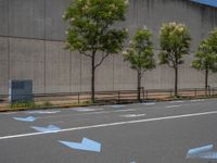 empty road with white lines on the streets of city area against cloudy blue sky on a sunny day