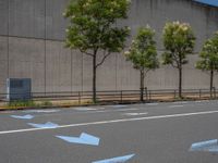 empty road with white lines on the streets of city area against cloudy blue sky on a sunny day