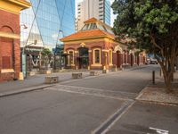 the city streets are empty in this photo, which appears to be an outdoor shopping district