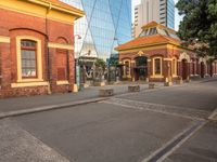 the city streets are empty in this photo, which appears to be an outdoor shopping district