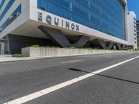 a large, tall building that has a sign on the outside of it saying equinex