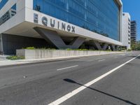 a large, tall building that has a sign on the outside of it saying equinex