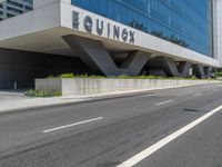 a large, tall building that has a sign on the outside of it saying equinex