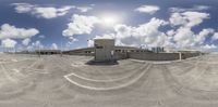 this is an 360 - view of a city street from a fisheye lens with no vehicles around