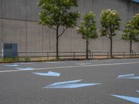 empty road with white lines on the streets of city area against cloudy blue sky on a sunny day