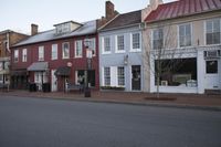 a town street is pictured in this picture with old buildings around it and flags flying out