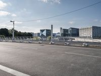 a street near a highway with a couple of bicycles sitting on it and a few cars going down the road